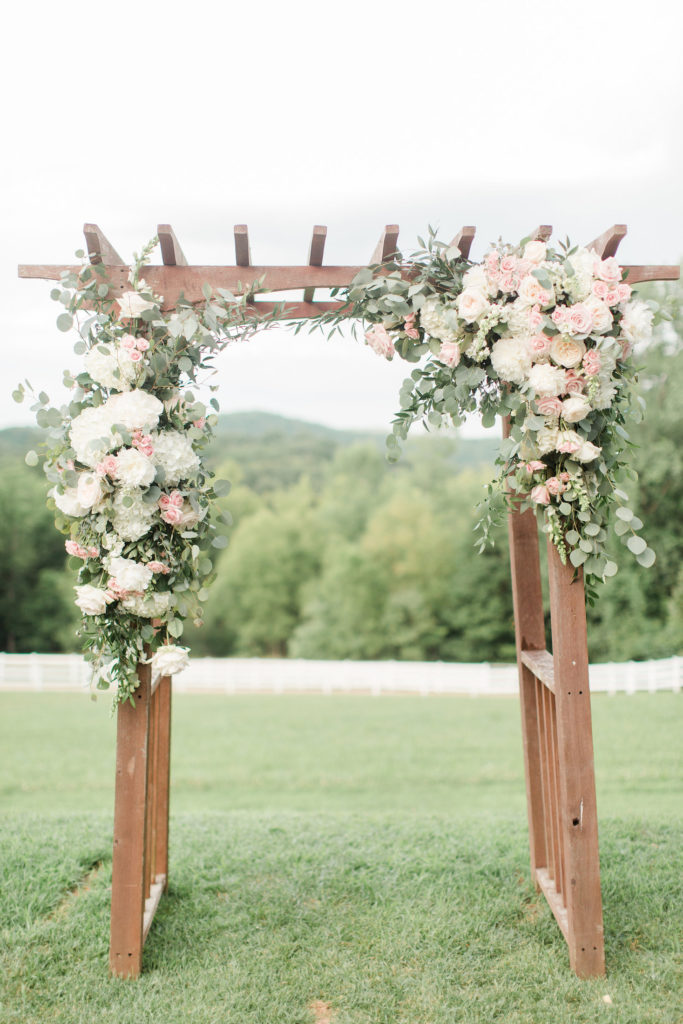 blush floral wooden wedding arbor