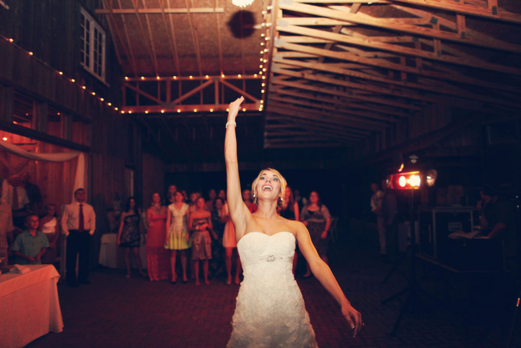 bouquet toss rustic barn wedding