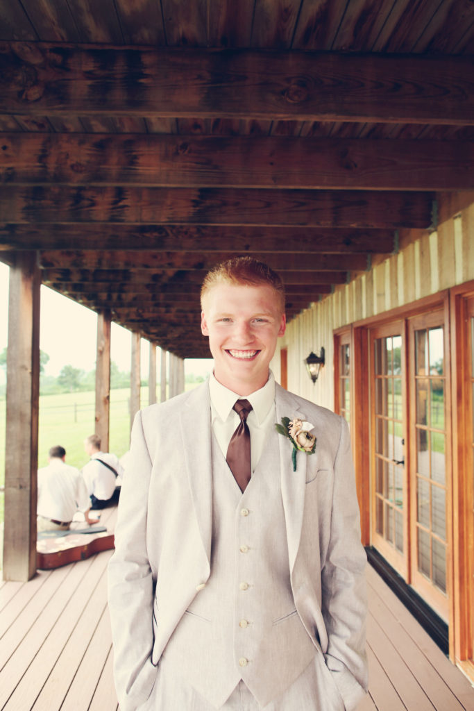 groom rustic barn wedding